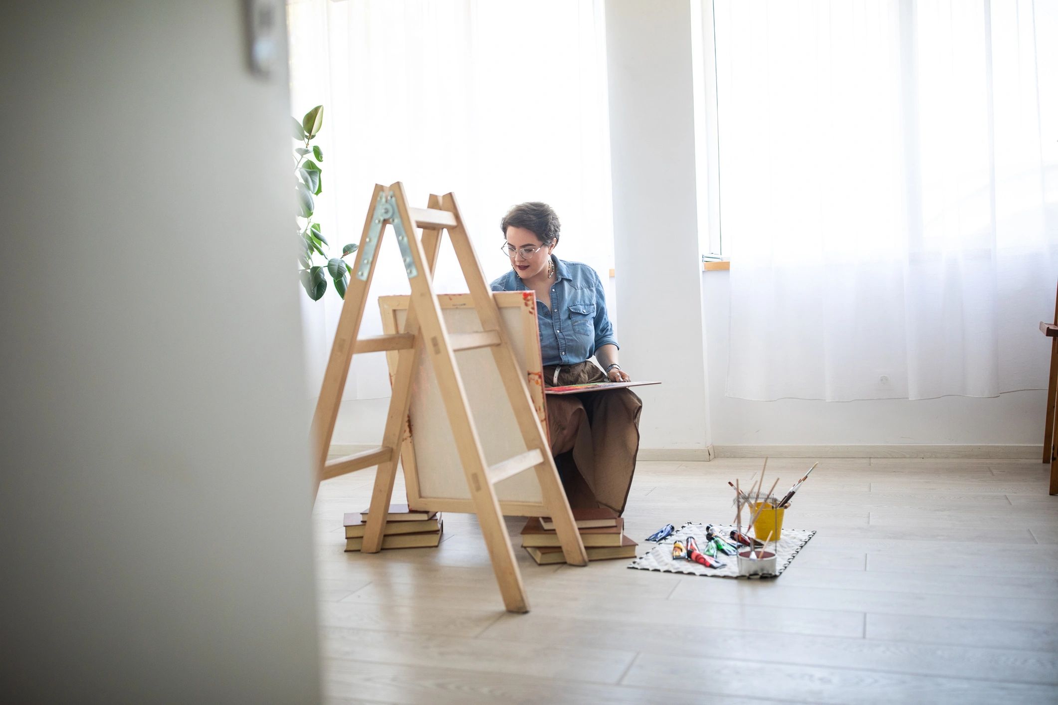 Artist painting in a colorful studio